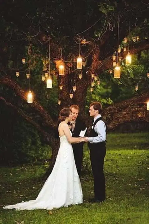 lanterns strung in trees weddingfor1000.com