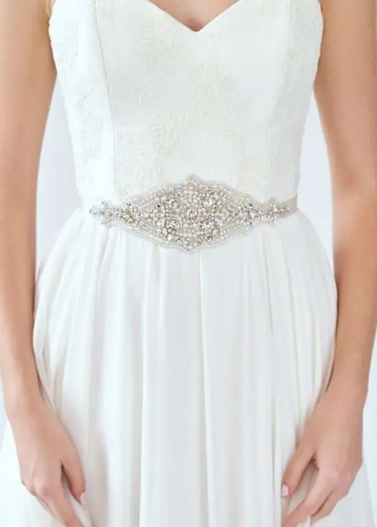 A beaded belt cinches your wedding day look