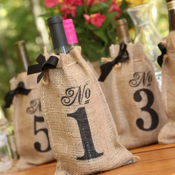 wine-bottle-table-numbers-burlap-bags